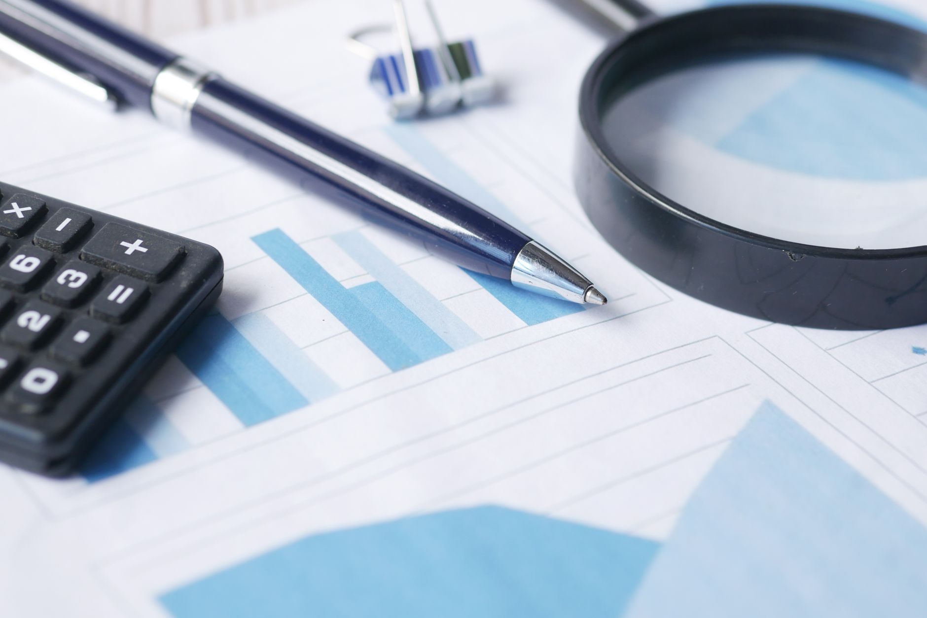 A magnifying glass over financial figures