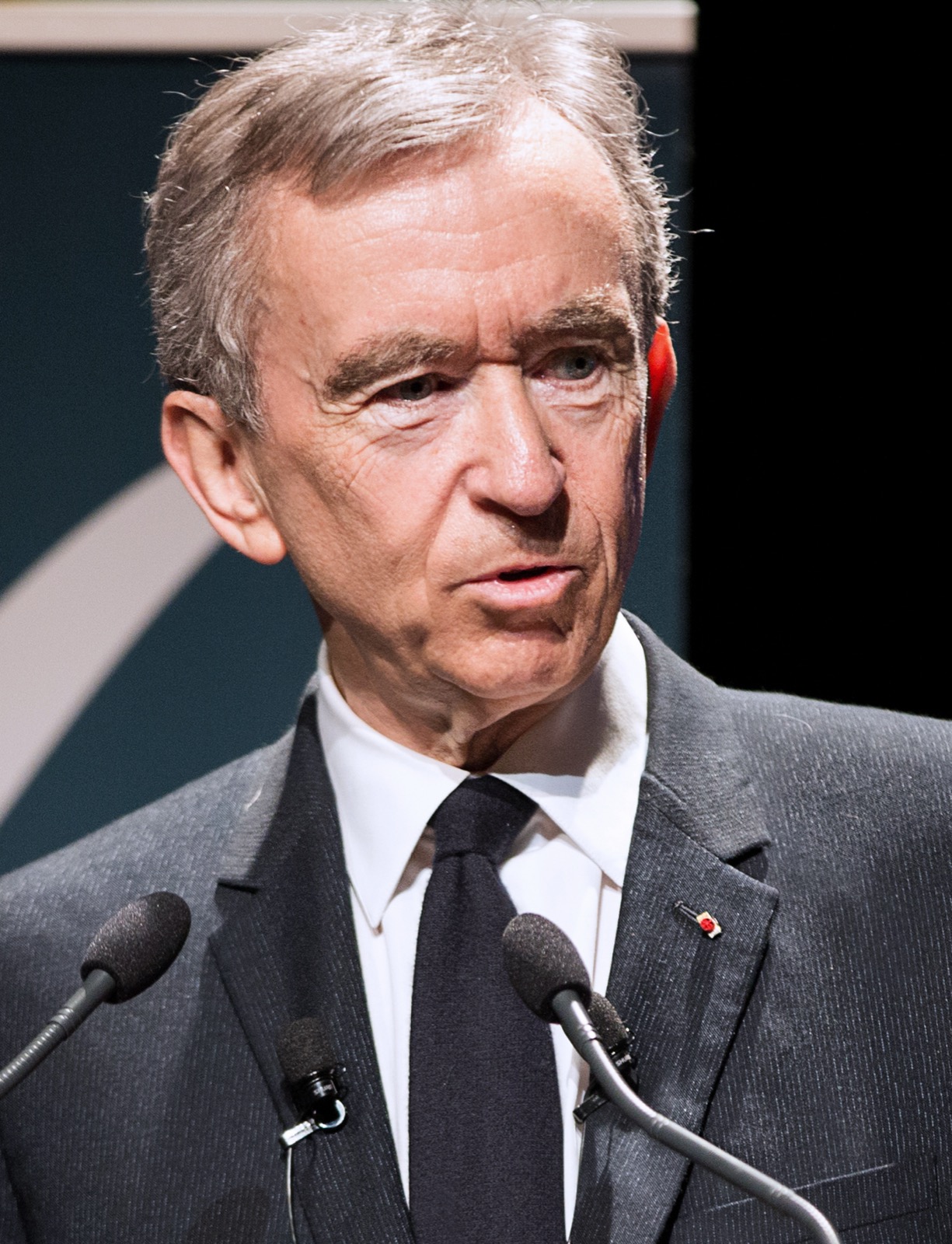 Bernard Arnault speaking at the École polytechnique, 14 March 2017 — at 77 he is folding the companies that control LVMH into one listed partnership of which he stays managing partner, above a family company his five children own in equal fifths