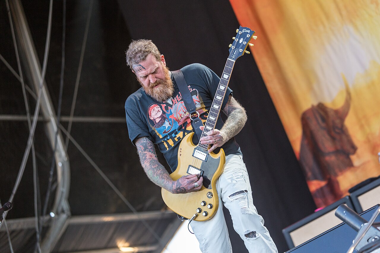 Brent Hinds, co-founder and lead guitarist of Mastodon, on stage at Nova Rock 2017 in Austria; he was told he was out in March 2025, died in August 2025, and his estate sued the band in September 2026