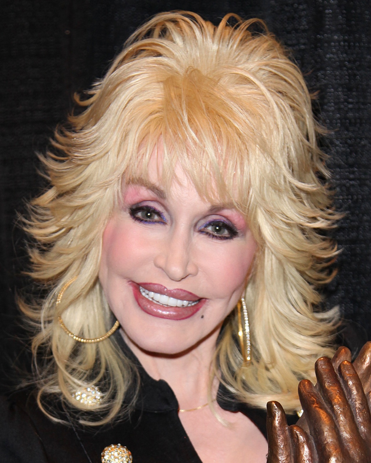 Dolly Parton accepting the Liseberg Applause Award, 16 November 2010 — the singer died in Nashville on 25 August 2026, and three weeks later the DP Dean Trust that holds her properties and business interests dismissed her nephew as head of security while confirming his share of the trust