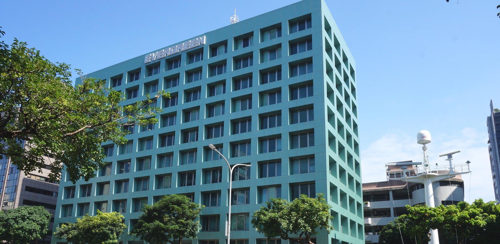 The Evergreen Marine Building on Minsheng East Road, Taipei — the corporate green of the group Chang Yung-fa founded, whose shipping and airline dividends now sit in the executors' joint account
