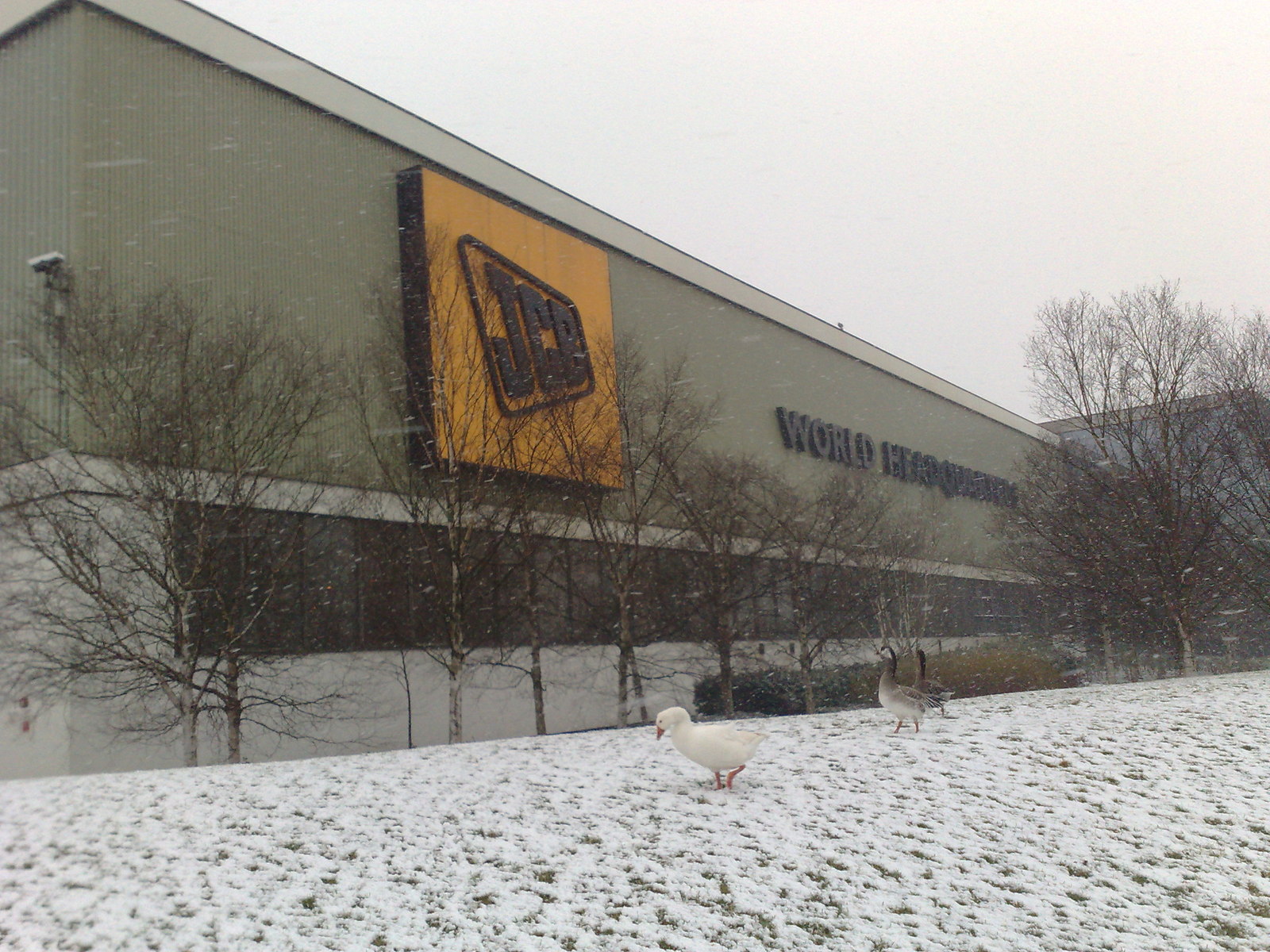 JCB World Headquarters at Rocester, Staffordshire, in snow in February 2009: the company is owned through a trust whose controller is recorded at Companies House