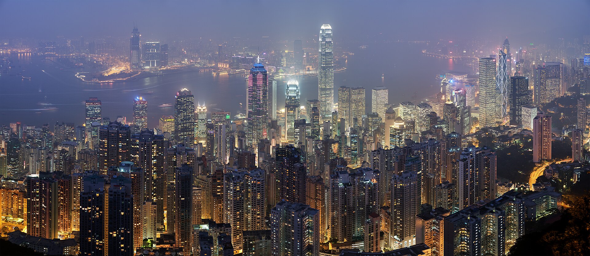 Hong Kong's Central district and Victoria Harbour from the Peak at night — where HSBC Life wrote the Guinness-certified US$250 million policy in 2024 and where the Insurance Authority's premium-financing circular landed on 20 August 2026