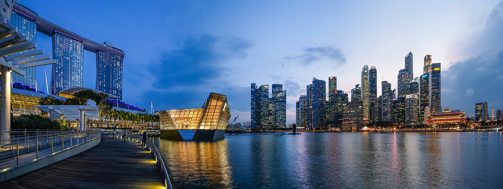 Singapore's Marina Bay at dusk: Marina Bay Sands on the left, the Central Business District towers on the right — the market in which Manulife Singapore issued a single US$300 million life policy in February 2026
