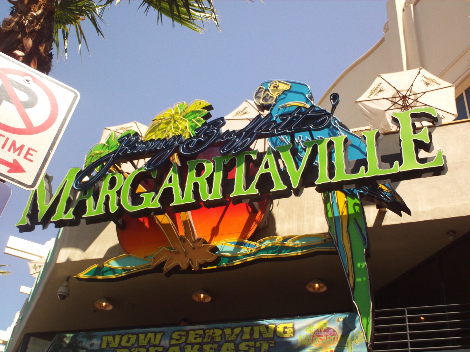 The neon Jimmy Buffett's Margaritaville sign over the restaurant entrance in Las Vegas, 2009 — the brand built on one song, whose founder's US$275 million marital trust is now in its second year of litigation in Palm Beach